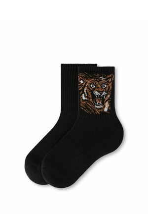 Coppia di calzini neri alla caviglia con un design dettagliato di una tigre arancione e bianca che ruggisce vicino al bordo superiore.