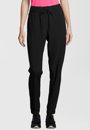 Athlecia AUSTBERG - Tracksuit bottoms - black
