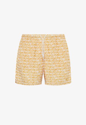 Shorts da bagno gialli con una stampa testuale bianca su tutta la superficie che riporta "Emporio Armani." Include un elastico in vita con stringa regolabile e un tessuto leggero.