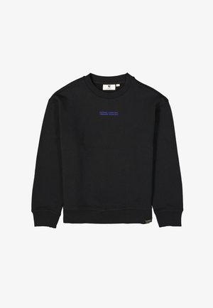 Schwarzes Sweatshirt aus weichem Stoff mit langen Ärmeln, gerippten Bündchen und Rundhalsausschnitt. Mit blauer Aufschrift: "INSPIRING LANDSCAPES TREKKING TEAM 1972."