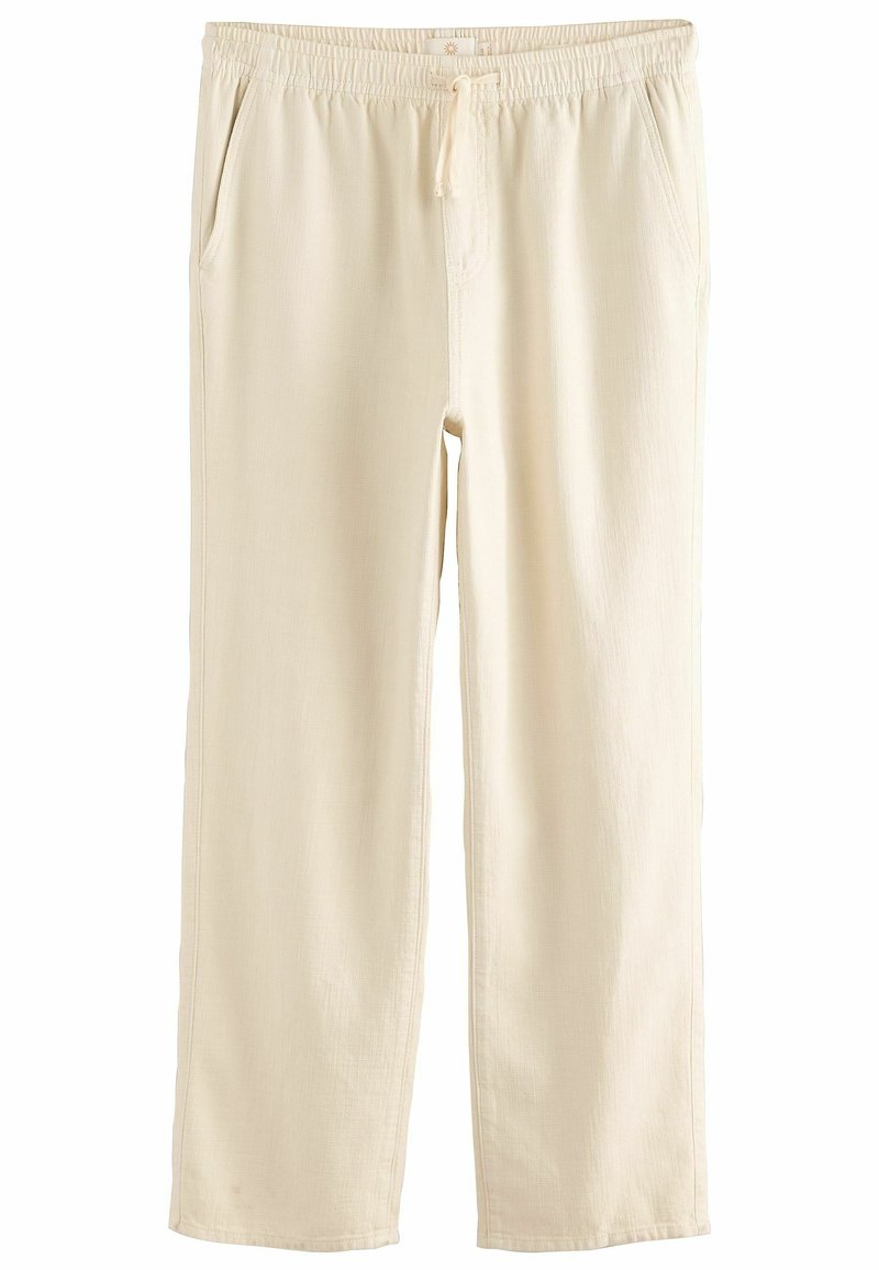 Pantalons beige, légers, à coupe décontractée avec une taille élastique et un cordon de serrage. Comprend deux poches latérales et une texture de tissu lisse.