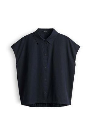 Chemise noire à manches courtes avec boutons, col et coupe ample, présentée à plat sur fond blanc.