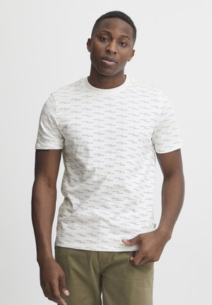 White short-sleeve t-shirt featuring a repeating blue and black text pattern. Crew neckline; made from soft, lightweight fabric.