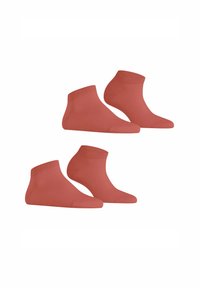 Chaussettes en coton de couleur corail, avec un bord côtelé et une texture lisse. Deux paires sont exposées.