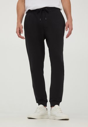 - Spodnie treningowe