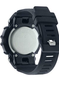 Montre en résine noire avec un boîtier texturé, un fond en acier inoxydable et un bracelet en caoutchouc strié. Vis notables et marquage résistant à l'eau présents.