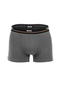 Boxer-briefs en coton gris avec une texture lisse, un design ajusté et une taille noire ornée de la marque "BOSS" et d'un accent doré.