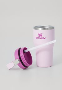Pink stainless steel tumbler with a metal lid and silicone straw, featuring a purple plastic cap and the "STANLEY" logo in matching pink.