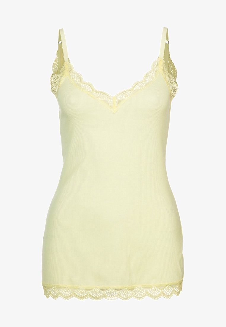 Ljust gul, ribbad linne med delikat spetskant längs halsringning och fåll. Utrustad med justerbara band och en figurnära design.