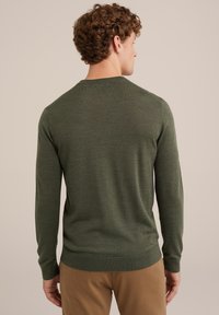 Green, long-sleeve sweater with a crew neck. Made of a smooth, fine-knit material. Features ribbed cuffs and hem.