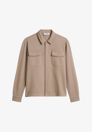 Beige button-up shirt with a soft texture, featuring a collar, two chest pockets, and long sleeves. Front buttons are a matching color.