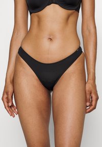 Skiny DAMEN CHEEKY - Stringi - black