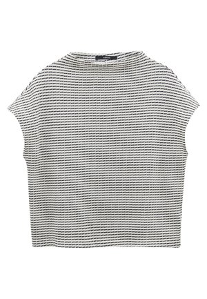 Top à manches courtes, ample, avec un motif texturé en grille noir et blanc, un col rond et un ourlet droit.