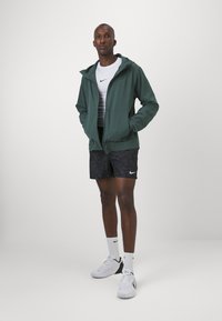 Nike Performance UNLIMITED - Tréning dzseki - vintage green/black