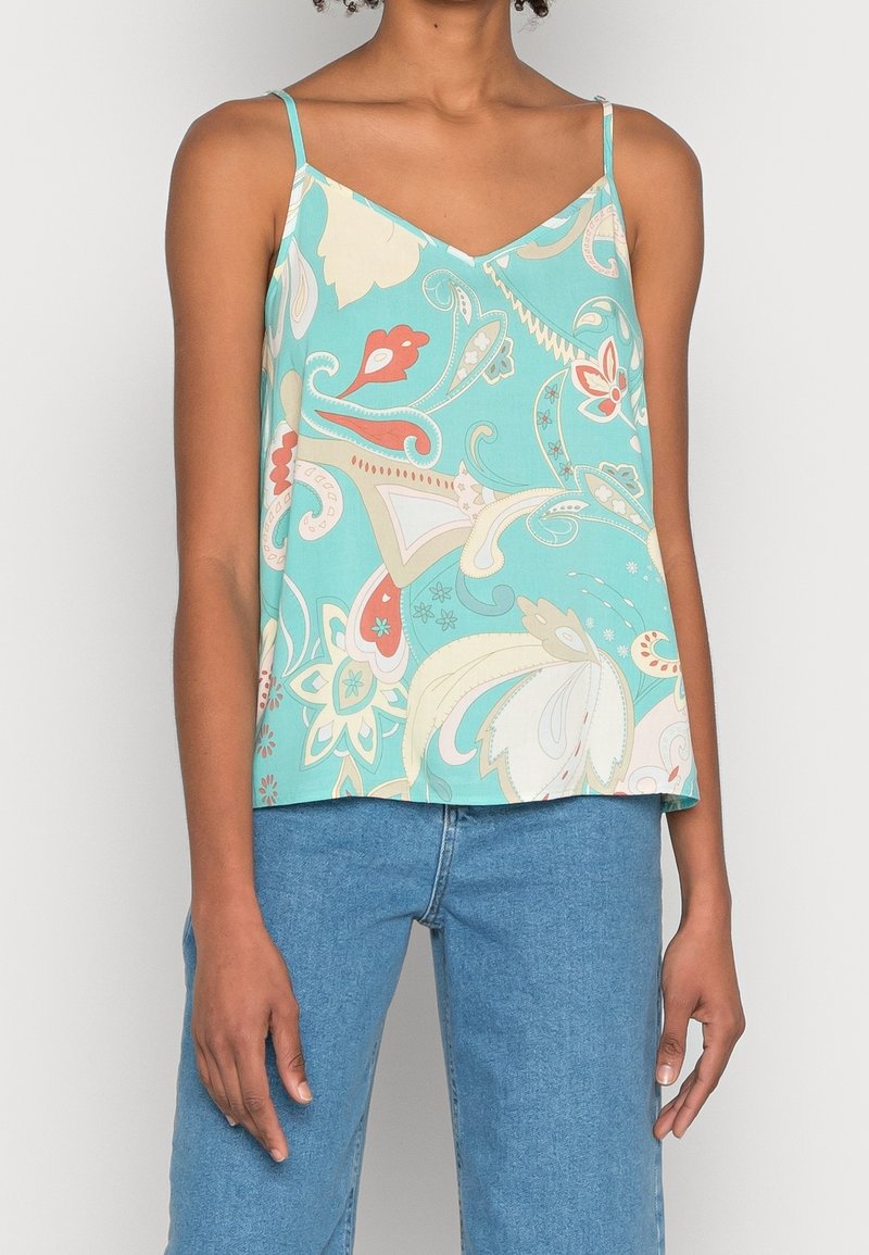 Un haut sans manches vert menthe avec un décolleté en V, présentant un motif floral et cachemire dans des teintes de corail, crème et teal. Fabriqué en tissu doux.