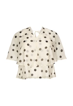 Biała przezroczysta bluzka w czarne groszki, z warstwowymi krótkimi rękawami i wiązaniem przy dekolcie w kształcie litery V.
