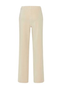 Pantalons en velours côtelé beige à jambe large, présentant une texture lisse, des passants de ceinture et une coupe classique avec un ourlet propre à la cheville.
