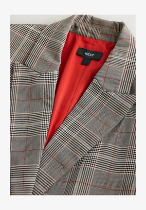 Gray plaid blazer with orange lining, featuring a notched collar, two patch pockets, and black label with brand name. Textured fabric.
