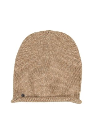 Light brown knitted beanie with a rolled edge and a small round metal logo near the bottom.