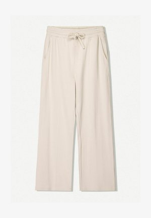 Hosszú szárú, világos bézs színű nadrág, elasztikus derékkal és húzózsinórral, oldalzsebekkel, valamint sima, könnyű textúrával.