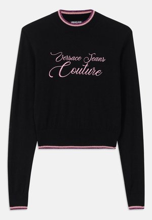 Black sweater featuring "Versace Jeans Couture" in pink cursive. Ribbed crew neckline and hem with pink and purple striped accents. Long sleeves.