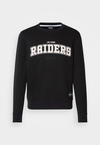 Sweatshirt preto com a inscrição "LAS VEGAS RAIDERS" em texto branco em negrito, gola redonda e punhos canelados. Feito de um tecido macio e durável.