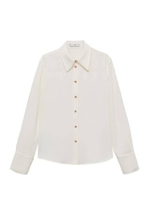 Blouse blanche à manches longues, fabriquée en tissu léger, avec un col pointu, une fermeture à boutons sur le devant avec des boutons en ton or et des poignets à un bouton.