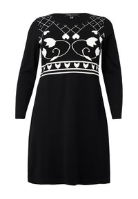 Robe noire à manches longues avec des motifs floraux et géométriques blancs sur la poitrine et la taille, conçue pour un look élégant.