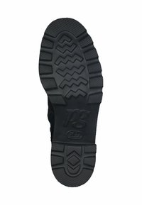 Zwarte rubberen zool met een zigzagprofiel, een geperst logo en versterkte delen voor duurzaamheid.