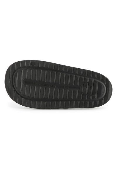 Zwarte rubberen schoenzool met een gestructureerd patroon van horizontale en verticale groeven voor grip. Afgeronde hiel en platte voorkant.