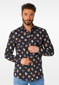 Crna košulja na dugih rukava sa uzorkom šarenih crtanih likova, ovratnikom i slim fit dizajnom.