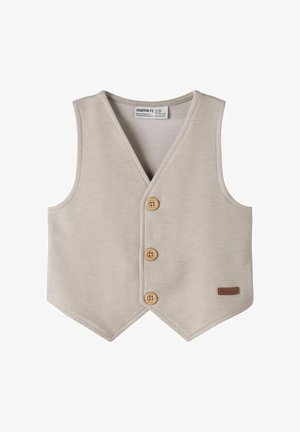 Veste beige tricotée pour tout-petit avec trois boutons en bois et une petite étiquette de marque marron en bas à droite.