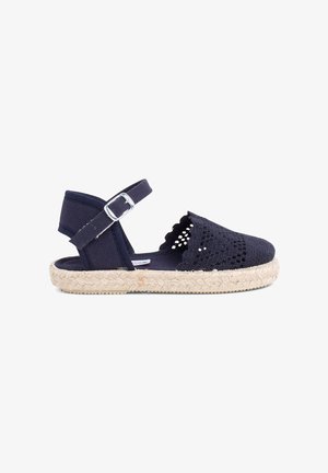Sandal con espadrille navy in tessuto intrecciato, dettagli a bordo ondulato, cinturino regolabile alla caviglia e suola avvolta in juta.