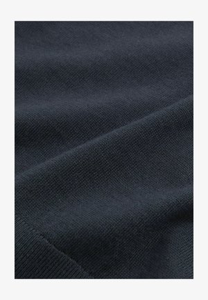 Navy blue knitted fabric with a smooth texture, featuring a subtle, tight weave and a slightly raised pattern throughout.