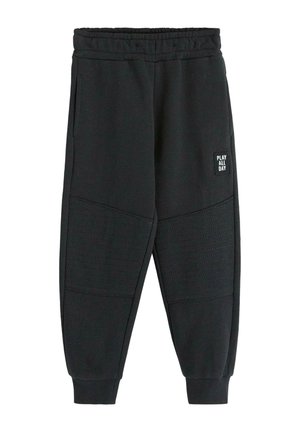 Pantaloni della tuta neri con un design a pannelli testurizzati, vita elastica e tasche laterali. Presenta un'etichetta "GIOCA TUTTO IL GIORNO" sul davanti.