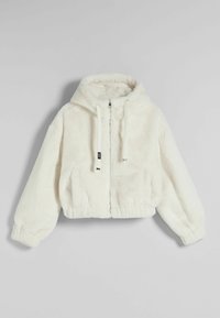 Kappad vit fleecejacka med huva, med långa ärmar, framfickor och dragsko. Mjuk textur och elastisk nederkant.