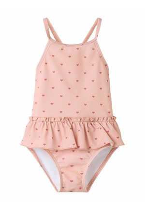 Vaaleanpunainen vauvan uimahame ohuilla olkaimilla, pienellä punaisella sydänkuviolla ja röyhelöhame vyötäröllä.