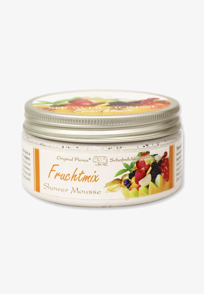 Fruchtmix Duschmousse in einem runden, weißen Behälter mit einem silbernen Deckel. Das Etikett zeigt bunte Obstillustrationen und orangefarbene Akzente.