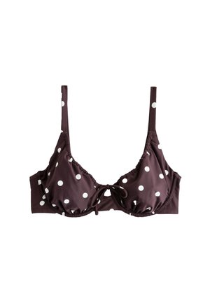 Top bikini marrone con pois bianchi, spalline regolabili, sostegno con ferretto e dettaglio con nodo frontale.