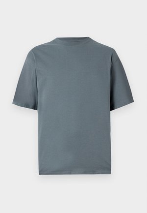 Grå bomulds t-shirt med korte ærmer, rund halsudskæring og en afslappet pasform. Glat tekstur, minimalistisk design og ingen synlige mønstre eller hardware.