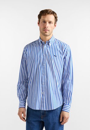 Camicia a maniche lunghe a righe blu e bianche con collo button-down, dotata di un piccolo logo e un orlo curvo. Vestibilità classica.