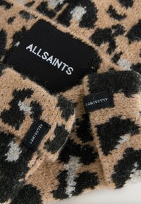 Leopard-print knit fabric in beige, black, and gray with a soft texture. Features black tags with "ALLSAINTS" logo.