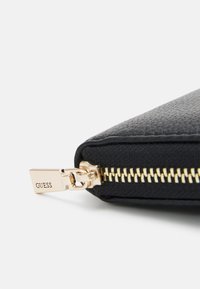 Guess MERIDIAN SMALL ZIP AROUND - Lommebok - black