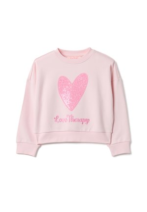 Felpa corta rosa con un grande cuore di paillettes e la scritta "Love Therapy" ricamata in rosa sul fondo. Tessuto strutturato, vestibilità comoda.