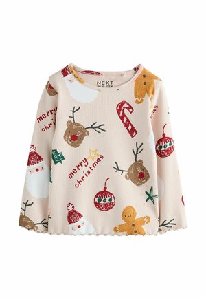 Helle beige Langarmbluse mit gerippter Textur, die bunte Weihnachtsmotive zeigt: Weihnachtsmann, Lebkuchen, Ornamente und Zuckerstangen.