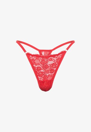 String en dentelle rouge avec motifs floraux, panneaux transparents et bretelles réglables. Des bandes élastiques assurent un ajustement parfait.