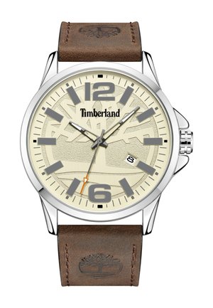Montre avec bracelet en cuir marron, boîtier rond en argent, cadran crème, marqueurs d'heure gris et aiguille des secondes orange, avec le logo Timberland.