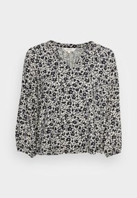 Blusa floral com um padrão em azul-marinho e creme, decote em V e mangas longas, ligeiramente bufantes. Feita de tecido leve e texturizado.