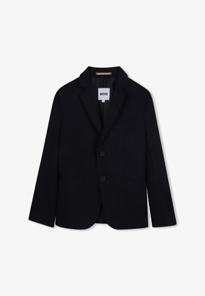 Blazer de marin cu rever în formă de clopot, deschidere cu două butoane și două buzunare laterale. Fabricat dintr-un material neted cu o croială ajustată. Eticheta spune "BOSS."