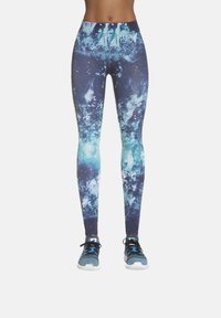 Legginsy w nadruk galaktyki w odcieniach ciemnoniebieskiego i turkusowego, wykonane z elastycznej tkaniny, z wysokim paskiem dla lepszego wsparcia.